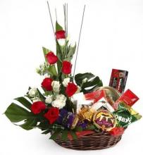 Basket arrangement of roses and 10 assorted bars of chocolates Basket arrangement of roses and 10 assorted bars of chocolates